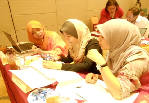 Malaysian participants discuss their action plan for a community-based prevention of drug abuse program